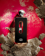 9 PM — Bottle on a red campaign backdrop