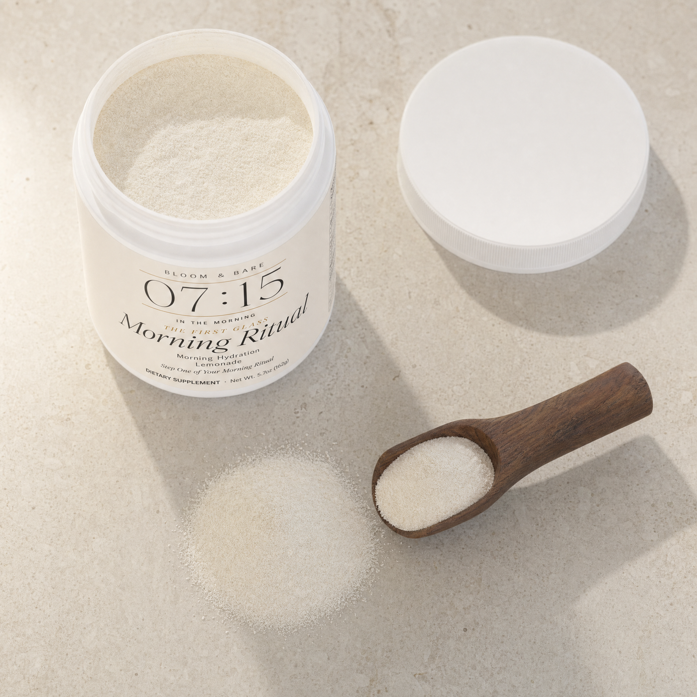 The scoop — fine ivory powder on travertine