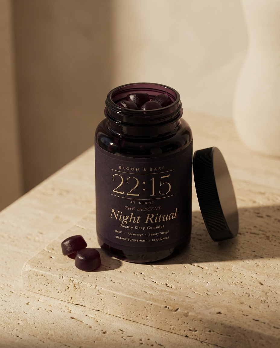 The 22:15 jar open on travertine, gummies beside the lid