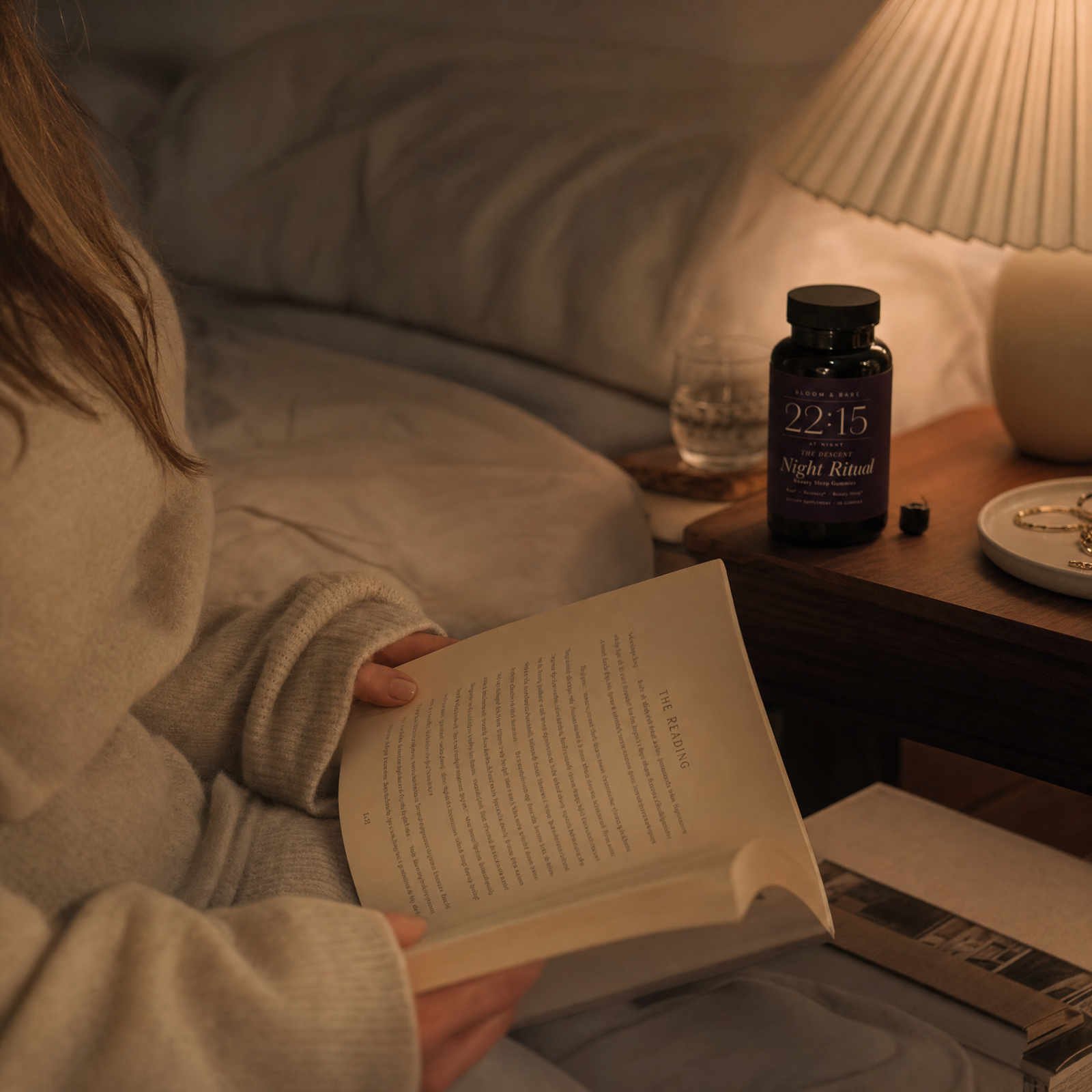 The reading — lamplight at the bedside